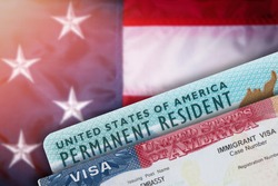 Immigration VISA United States of America. Green Card US Permanent resident. Work and Travel documents. US Immigrant. Embassy USA. Visa in passport. American government flag on background. 
