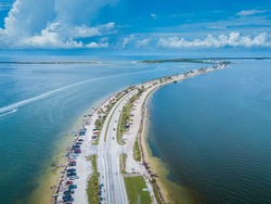 Honeymoon Island Beach. Dunedin Causeway. Summer vacation. Florida USA. Blue-turquoise color of salt water. Ocean or Gulf of Mexico. Summer vacations. Aerial view.