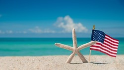 Beach, Ocean, Starfish, American flag. Summer vacations. Atlantic Ocean. Florida paradise. Sunny day. Beautiful Turquoise color of ocean salt water. Tropical nature. Seascape concept for travel agency