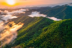 Mountains. Colorful sunset. Panorama of Great Smoky Mountains North Carolina. Scenic aerial view. Fly over clouds or fog. Green forest. Green hill. Hiking tourism. Good for travel agency or posters.