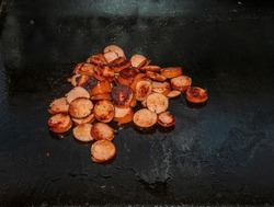 Polska kielbasa sausage cooking on the Blackstone griddle￼