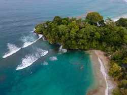 GREEN COSTA RICAN JUNGLE MEETS THE BLUE CARIBBEAN SURF