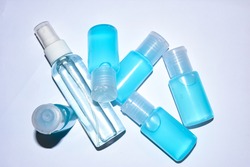 Closed up picture of alchohol gel spray plastic bottles with white background, useful for cleaning.