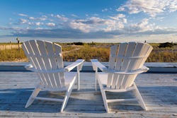 Beach chair on Cape Cod beach at sunset, Cape Cod, Massachusetts, USA.