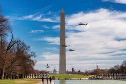 Helicopters in flight with US President at the Washington Monument, Washington, DC, USA