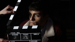 the clapperboard on the actor's face before shooting begins