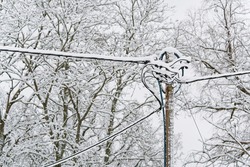 street lighting electric wires under the snow