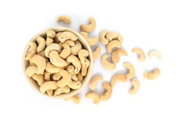 cashew in white bowl top view on white background.