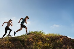 Trail Runner of men and women running on the mountain
