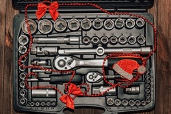 Nuts tools in a box with Christmas toys, gift concept for a man.