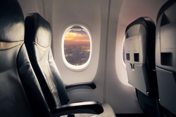 Empty seat on airplane while covid-19 outbreak destroy travel and airline business, health care and travel concept. Focus on window.
