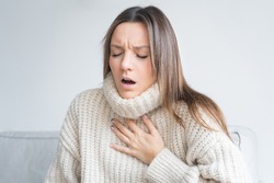 Woman having breath difficulties. Shortness of breath. Coronavirus cough breathing problem