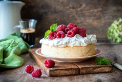 Angel food cake with whipped cream and fresh raspberries