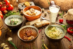 Variation of different georgian soups on wooden table