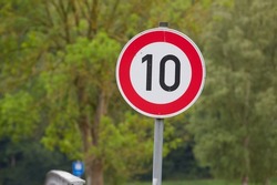 speed limit sign showing ten (10) kmh