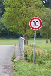 speed limit sign showing ten (10) kmh