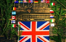The flag of Great Britain on a Christmas wooden background.