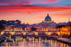 Night view of St. Peter's cathedral and Tiber river in Rome, Italy