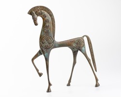 Bronze etruscan horse sculpture on white background. Horse miniature.