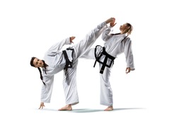 Karate woman in action isolated in white