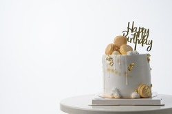 birthday cake with candles and macarons food anniversary concept cover banner background.