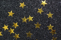 Shining stars amidst a glittering background / Golden stars / Symbolic signs of success