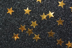 Shining stars amidst a glittering background / Golden stars / Symbolic signs of success