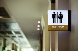 Public restroom signs at the entrance in the meeting room