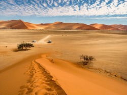 Amazing View from the dune to the salt pan of Sossusvlei. Namib Naukluft National Park. Sand dunes in the pan of Sossusvlei. Namibia. Africa.
