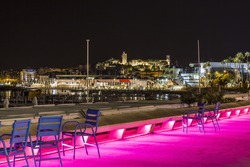 Image shows the cosmopolitan city of Cannes in the French Riviera, in the background illuminated city