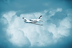 Single piston aircraft. Single-propeller aircraft flying over the blue sky. Single turboprop aircraft.. Small private plane flying in blue clouds.