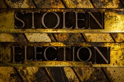 Stolen Election text message on textured grunge copper and vintage gold background
