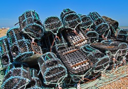 A colourful stack of blue and black lobster pots piled on Dungeness beach (Kent,UK)