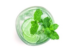 Overhead or top view shot of the fresh cool infused water of lime and mint or mojito cocktail look on white background