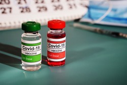 Two ampoules with doses from Covid. Two stages of vaccination. Vaccination. Copying a space.