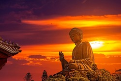 Tian Tan Buddha statue over scenic sunset sky background, Hong Kong, Lantau Island