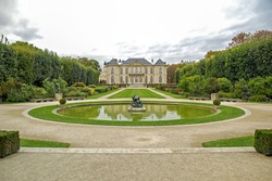 panorama of beautiful garden with pond in Auguste Rodin museum. Paris, France