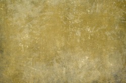 Old ochre scraped wall grungy background or texture 