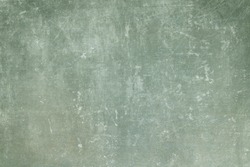 Old green grungy wall background or texture 