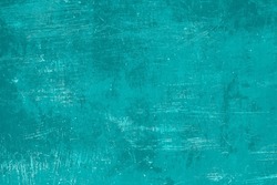Old worn out turquoise colored metal sheet background, grunge texture 