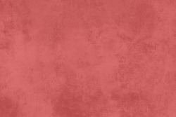 Red coral painted wall with worn out finish, grunge background 