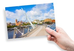 Urban skyline of DERRY city, also called LONDONDERRY, in northern IRELAND with the famous PEACE BRIDGE - Europe - Northern Ireland - concept image