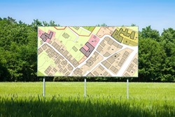 Advertising billboard with an imaginary General Urban Plan with indications of urban destinations buildable areas, land plot - NOTE: the map is totally invented and does not represent any real place