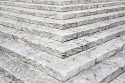 Eliminating or overcoming architectural barriers in public buildings or private buildings open to the public - old chiseled stone staircase with stone blocks