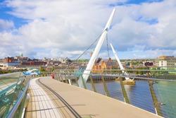Urban skyline of Derry city (also called Londonderry) in northern Ireland with the famous 