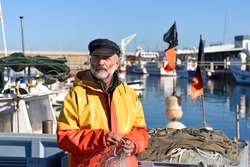portrait of a fisherman in the harbor