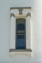 A window on the Yaquina Head Lighthouse