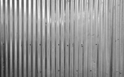 Metal stainless steel strips. Corrugated iron, Zinc wall, pattern texture. Close-up of exterior architecture material for design decoration background.