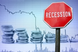 Recession sign on economy background - graph and coins. Financial crash in world economy because of coronavirus. Global economic crisis, recession. Corona virus pandemic, COVID-19 outbreak.