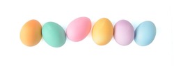Pastel Easter eggs in a row isolated on white background, top view